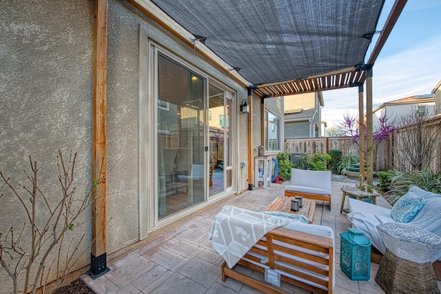 view of patio featuring an outdoor hangout area and a fenced backyard