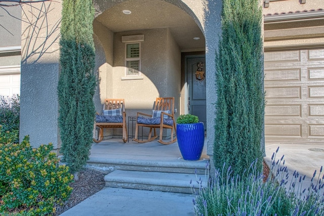 property entrance featuring stucco siding