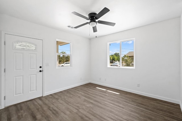 entrance foyer featuring ceiling fan, dark wood-style floors, visible vents, and baseboards