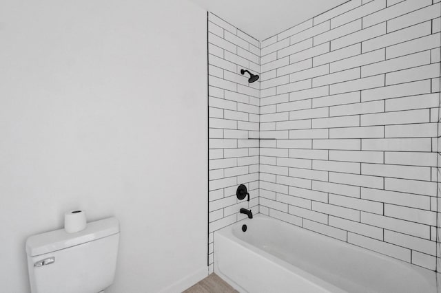 full bath with toilet, washtub / shower combination, and baseboards