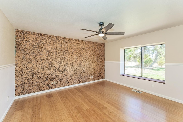 41371 Butte Way, Madera, CA 93636 - unfurnished room with light wood finished floors and ceiling fan