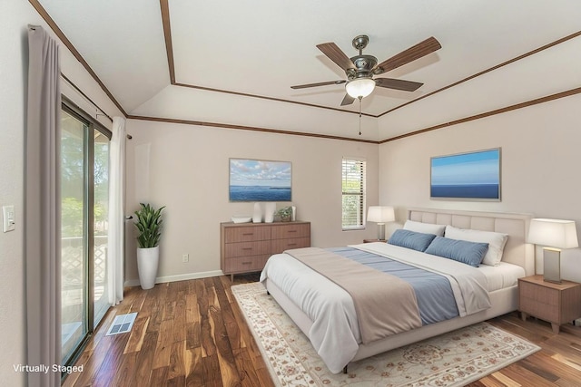41371 Butte Way, Madera, CA 93636 - bedroom featuring multiple windows, wood finished floors, vaulted ceiling, a raised ceiling, and ornamental molding
