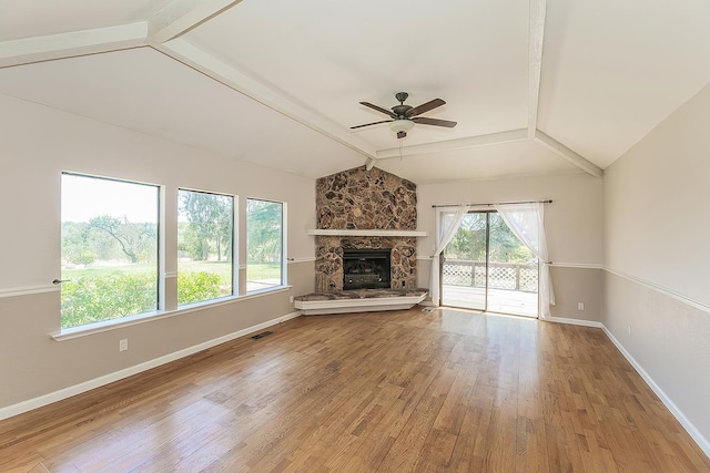 41371 Butte Way, Madera, CA 93636 - unfurnished living room featuring ceiling fan, light wood-style floors, and a stone fireplace