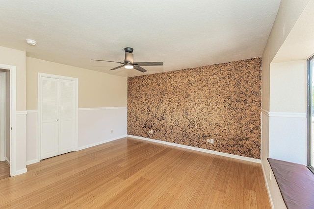 41371 Butte Way, Madera, CA 93636 - unfurnished room with light wood-type flooring, a ceiling fan, and a smoke detector