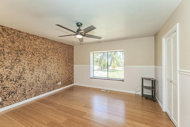41371 Butte Way, Madera, CA 93636 - unfurnished bedroom with light wood-style flooring, a closet, and ceiling fan