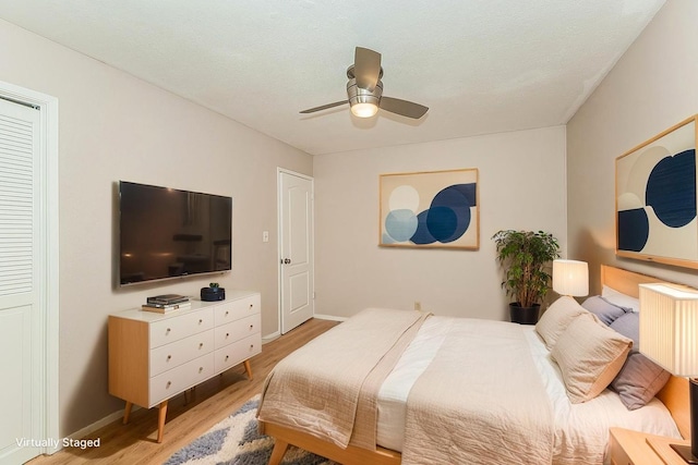 41371 Butte Way, Madera, CA 93636 - bedroom with light wood finished floors, a ceiling fan, and radiator