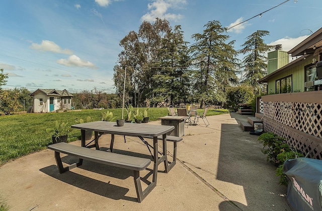 41371 Butte Way, Madera, CA 93636 - view of patio / terrace featuring an outbuilding and outdoor dining space