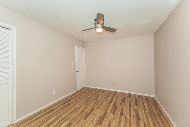 41371 Butte Way, Madera, CA 93636 - unfurnished bedroom with light wood-style floors and ceiling fan