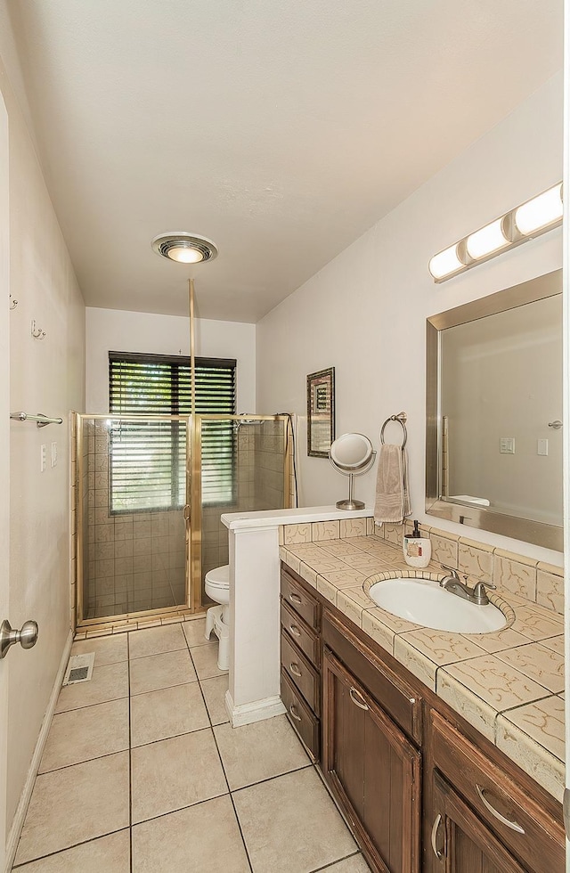 41371 Butte Way, Madera, CA 93636 - full bathroom with vanity, tile patterned flooring, and a shower with door