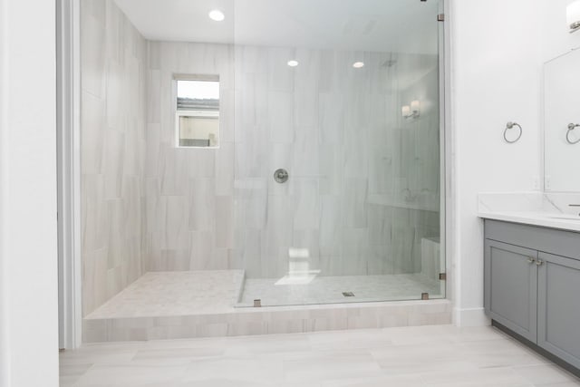 full bath with vanity and a stall shower