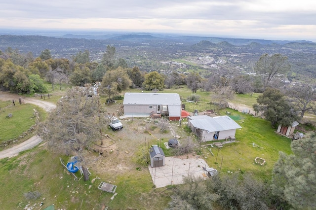 drone / aerial view with a rural view and a mountain view