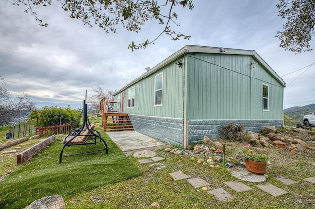view of home's exterior with a yard