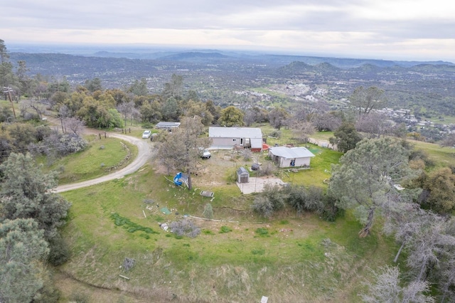 drone / aerial view with a mountain view and a rural view