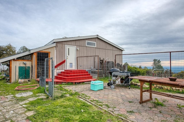 view of pole building with fence