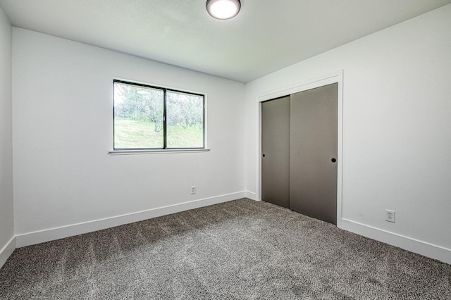 42741 Revis Way, Coarsegold, CA 93614 - unfurnished bedroom featuring dark colored carpet and a closet
