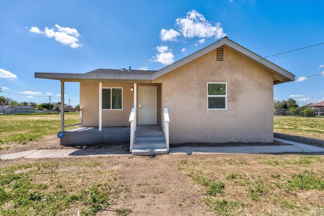 430 S Thorne Ave, Fresno, CA 93706 - view of front of house featuring stucco siding and a front lawn