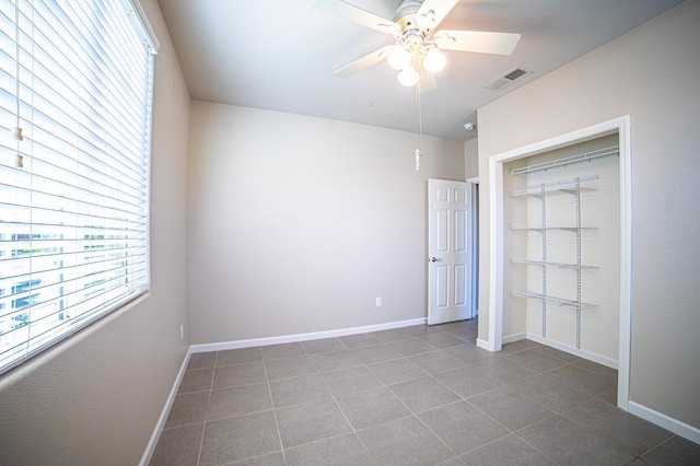 3418 El Molino, Clovis, CA 93619 - unfurnished bedroom featuring tile patterned floors, a ceiling fan, and a closet