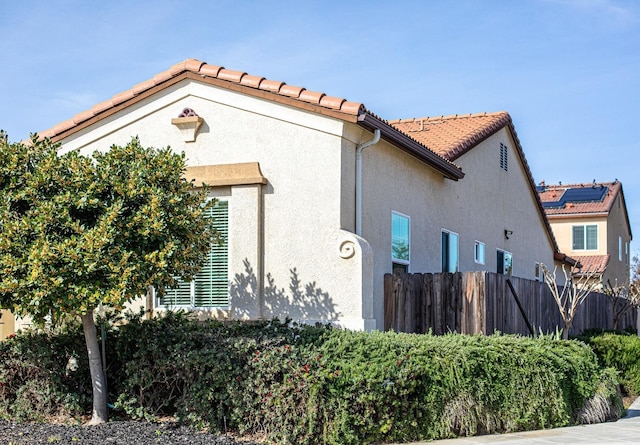 3418 El Molino, Clovis, CA 93619 - view of property exterior featuring stucco siding and a tile roof