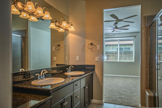 3418 El Molino, Clovis, CA 93619 - bathroom featuring a ceiling fan, double vanity, tile patterned floors, and tiled shower