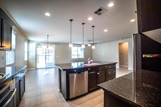 3418 El Molino, Clovis, CA 93619 - kitchen featuring stainless steel appliances, a kitchen island with sink, open floor plan, recessed lighting, and a chandelier