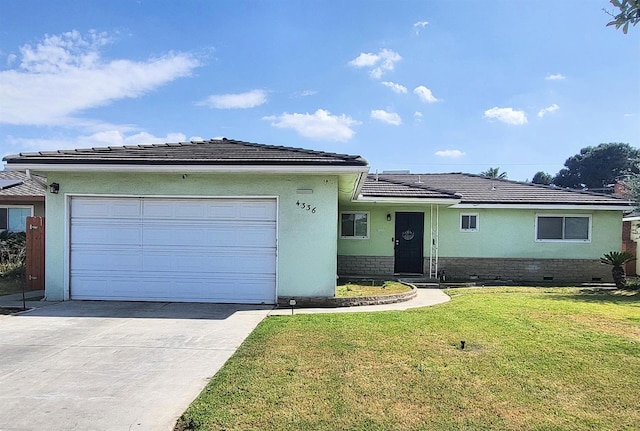 4336 E Austin Way, Fresno, CA 93726 - view of front of house with stucco siding, a garage, driveway, and a front lawn