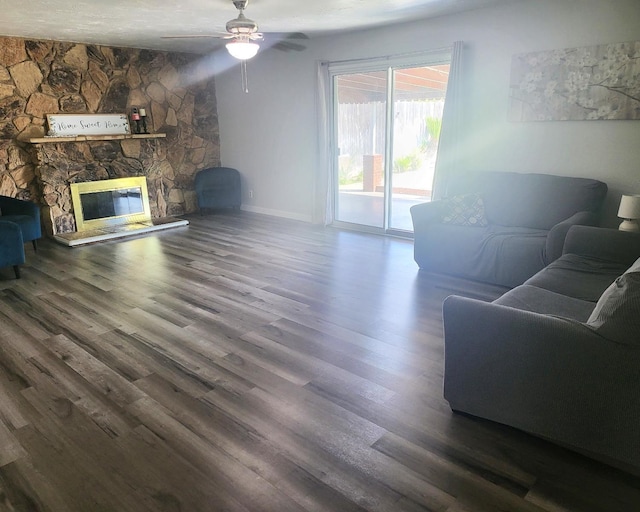 4336 E Austin Way, Fresno, CA 93726 - living area with a ceiling fan, wood finished floors, baseboards, and a fireplace