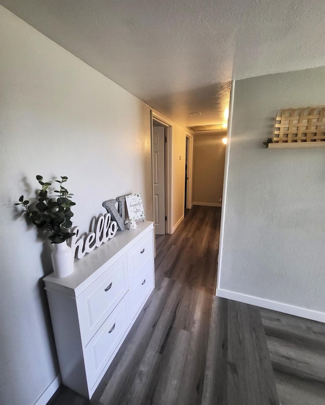 4336 E Austin Way, Fresno, CA 93726 - hallway featuring dark wood-style flooring, baseboards, and a textured ceiling