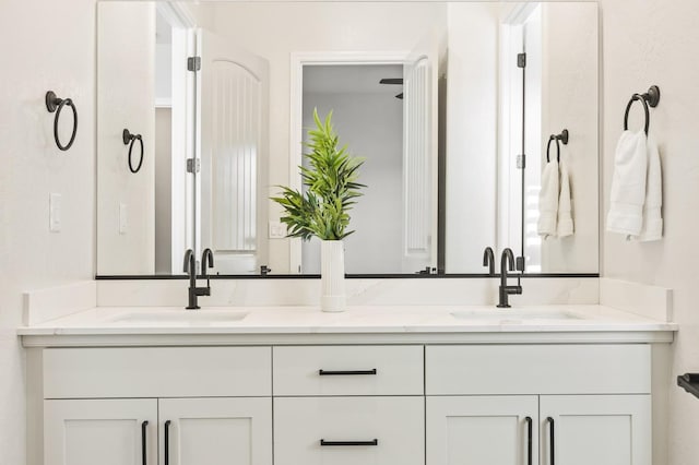 bathroom with double vanity and a sink