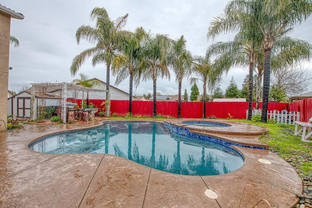 view of pool with a patio, a fenced in pool, a fenced backyard, an in ground hot tub, and a pergola