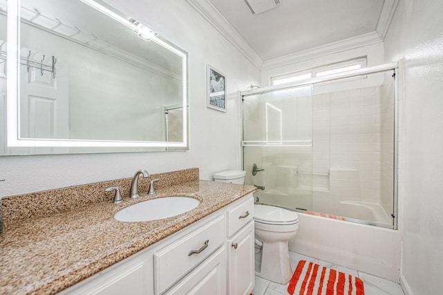 bathroom with visible vents, crown molding, toilet, vanity, and shower / bath combination with glass door