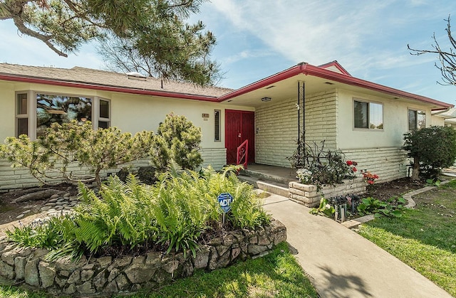 411 W Vartikian Ave W, Fresno, CA 93704 - single story home with brick siding and stucco siding
