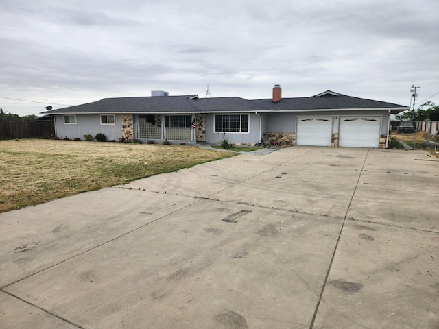 single story home featuring a garage, a front lawn, fence, a chimney, and driveway