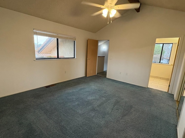 2512 Driftwood Dr, Madera, CA 93637 - carpeted empty room featuring visible vents, ceiling fan, and lofted ceiling