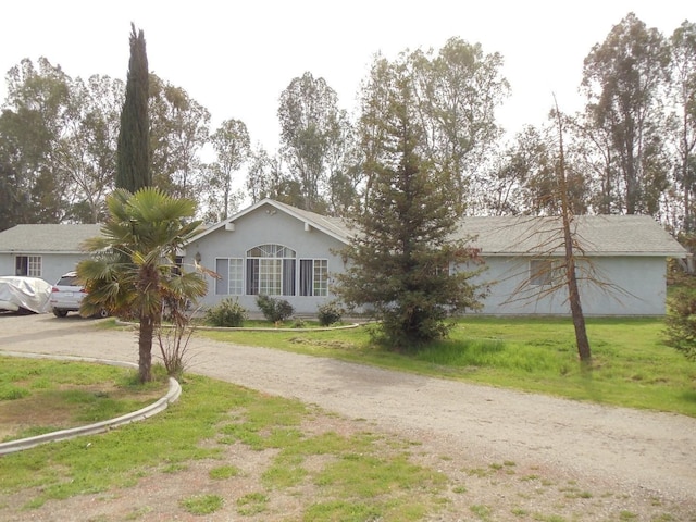 2744 N Locan Ave, Fresno, CA 93619 - single story home featuring driveway, a front yard, and stucco siding
