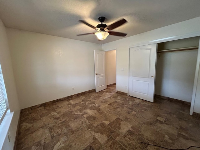 18149 Varden Dr, Madera, CA 93638 - unfurnished bedroom featuring stone finish floor, baseboards, a textured ceiling, a ceiling fan, and a closet