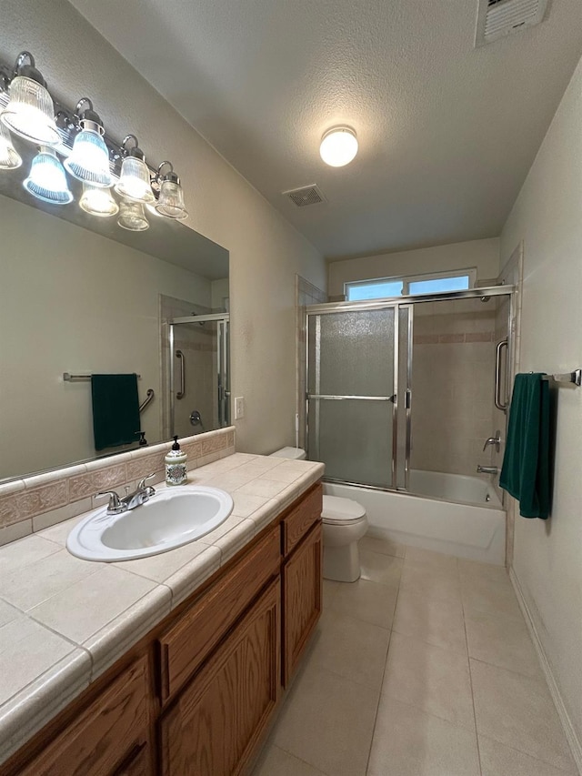 18149 Varden Dr, Madera, CA 93638 - bathroom with a textured ceiling, visible vents, tile patterned floors, and vanity