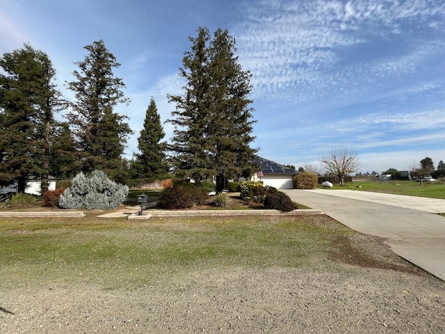 18149 Varden Dr, Madera, CA 93638 - view of front facade with a garage, concrete driveway, and a front yard