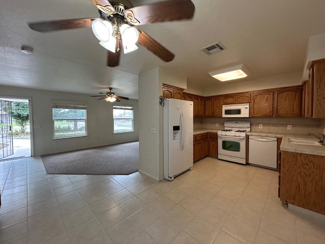 18149 Varden Dr, Madera, CA 93638 - kitchen featuring visible vents, white appliances, a ceiling fan, a sink, and open floor plan