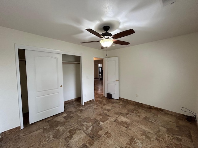 18149 Varden Dr, Madera, CA 93638 - unfurnished bedroom featuring a closet, visible vents, stone finish floor, baseboards, and a ceiling fan