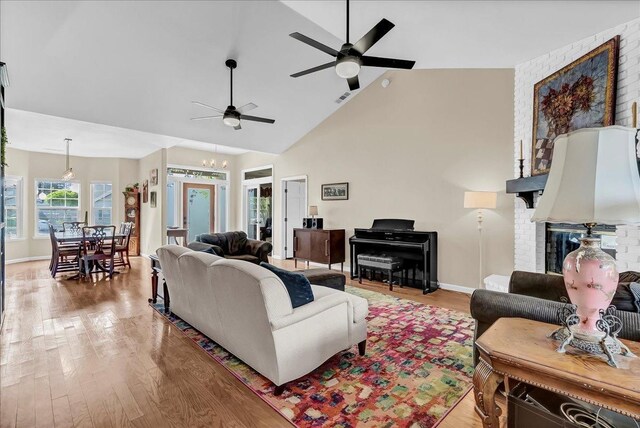 355 Old Line Ave, Exeter, CA 93221 - living room featuring visible vents, light wood-type flooring, baseboards, high vaulted ceiling, and ceiling fan