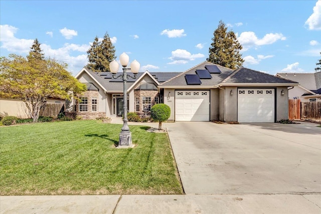 355 Old Line Ave, Exeter, CA 93221 - view of front of house featuring concrete driveway, an attached garage, fence, a front yard, and stucco siding