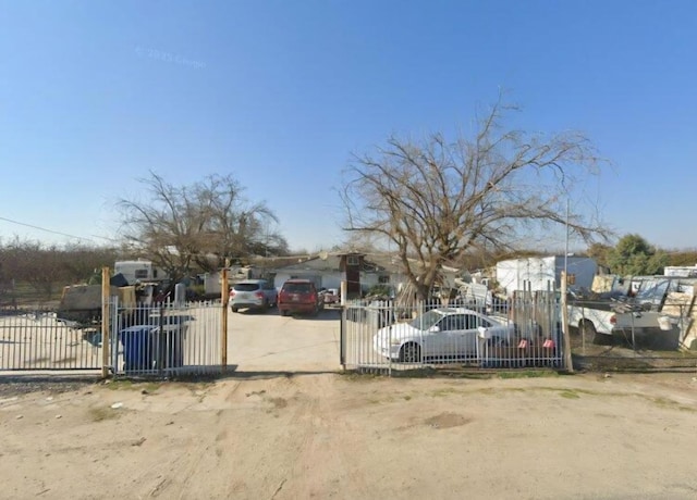 251 N Trinity Ave, Kerman, CA 93630 - view of front of house featuring a gate and a fenced front yard