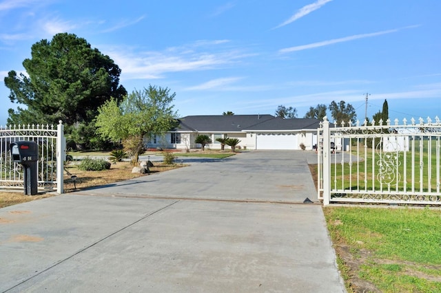 18294 Rd 27, Madera, CA 93638 - ranch-style house with driveway, an attached garage, and fence