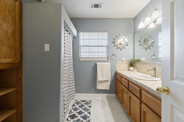 18294 Rd 27, Madera, CA 93638 - bathroom featuring vanity, a shower with shower curtain, baseboards, marble finish floor, and visible vents