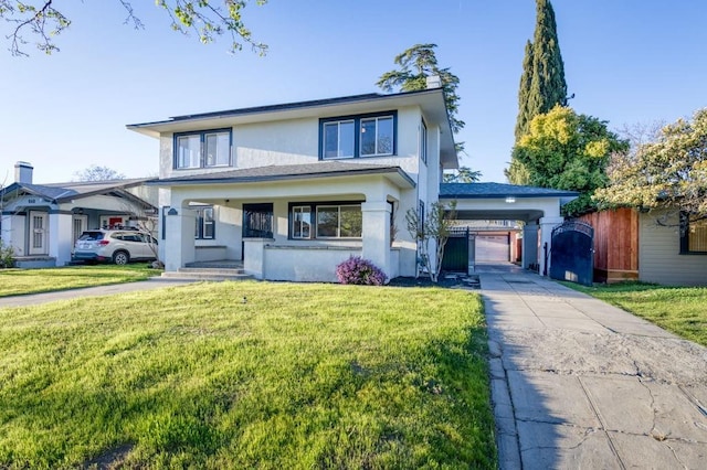 655 E Normal Ave, Fresno, CA 93704 - view of front of property with stucco siding, a carport, concrete driveway, and a front yard