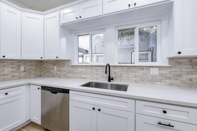 655 E Normal Ave, Fresno, CA 93704 - kitchen featuring stainless steel dishwasher, a sink, light countertops, and decorative backsplash