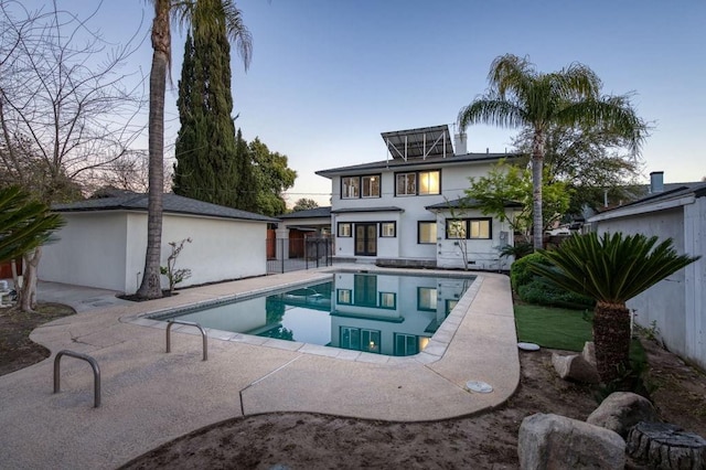655 E Normal Ave, Fresno, CA 93704 - back of house with a patio, an outdoor pool, and stucco siding