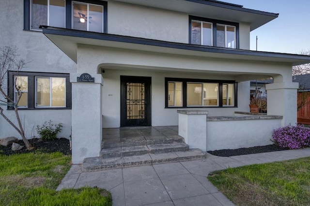 655 E Normal Ave, Fresno, CA 93704 - doorway to property featuring covered porch and stucco siding