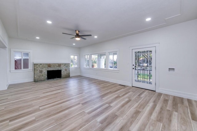 655 E Normal Ave, Fresno, CA 93704 - unfurnished living room featuring ceiling fan, light wood-style floors, baseboards, recessed lighting, and a fireplace