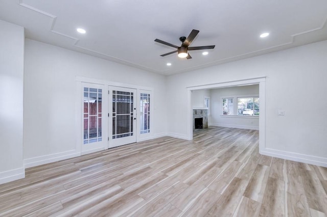655 E Normal Ave, Fresno, CA 93704 - unfurnished living room featuring light wood finished floors, a ceiling fan, baseboards, recessed lighting, and french doors